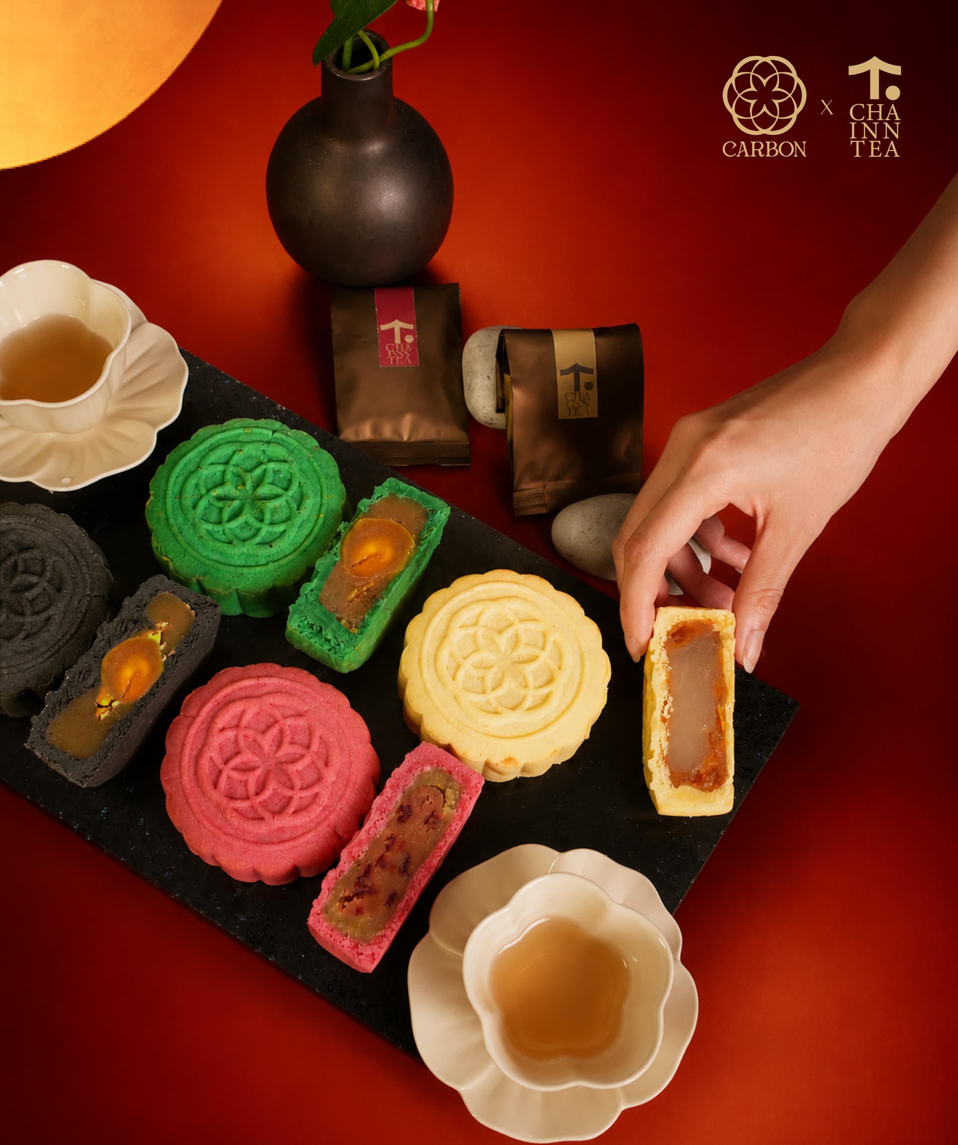 Overhead spread of all four Leaf & Ember flavours with tea
